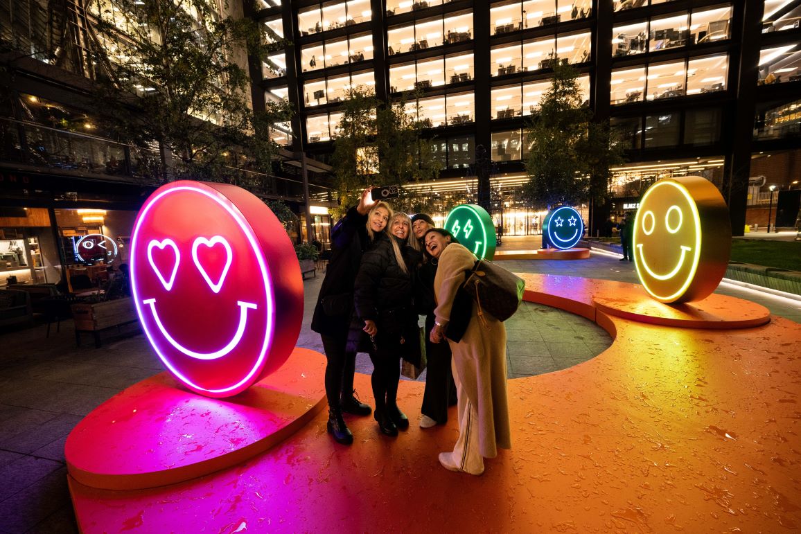 Visitors are posing enthusiastically at a event