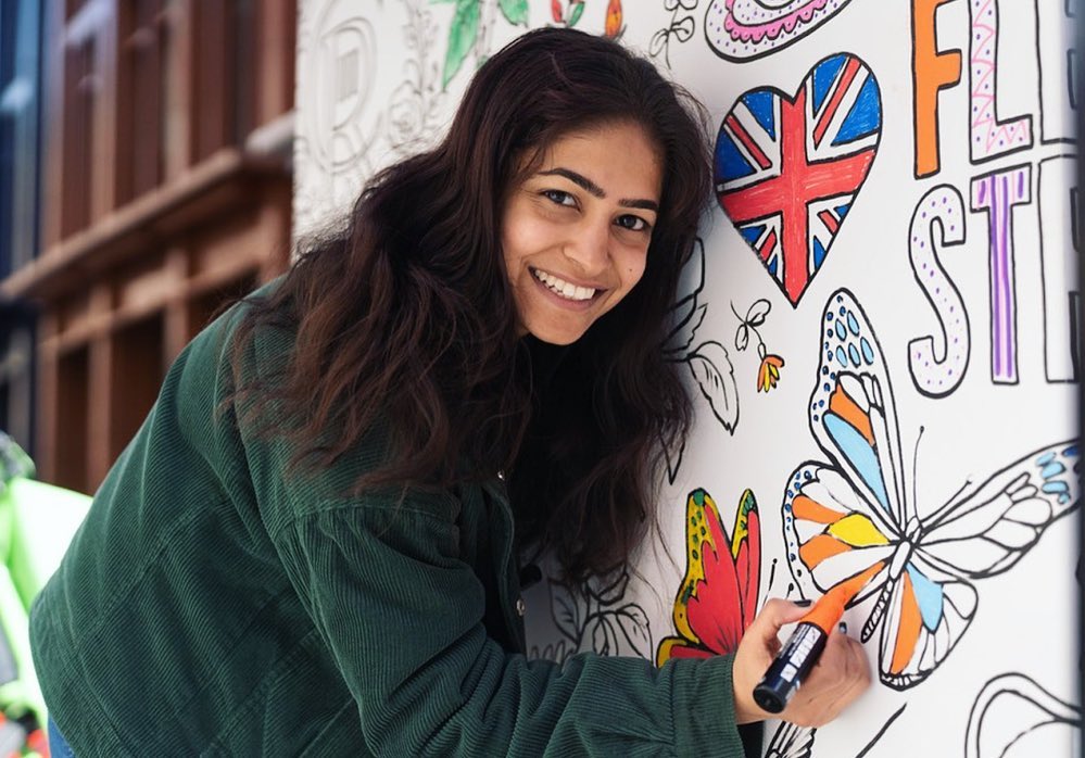 A girl is drawing on whiteboard