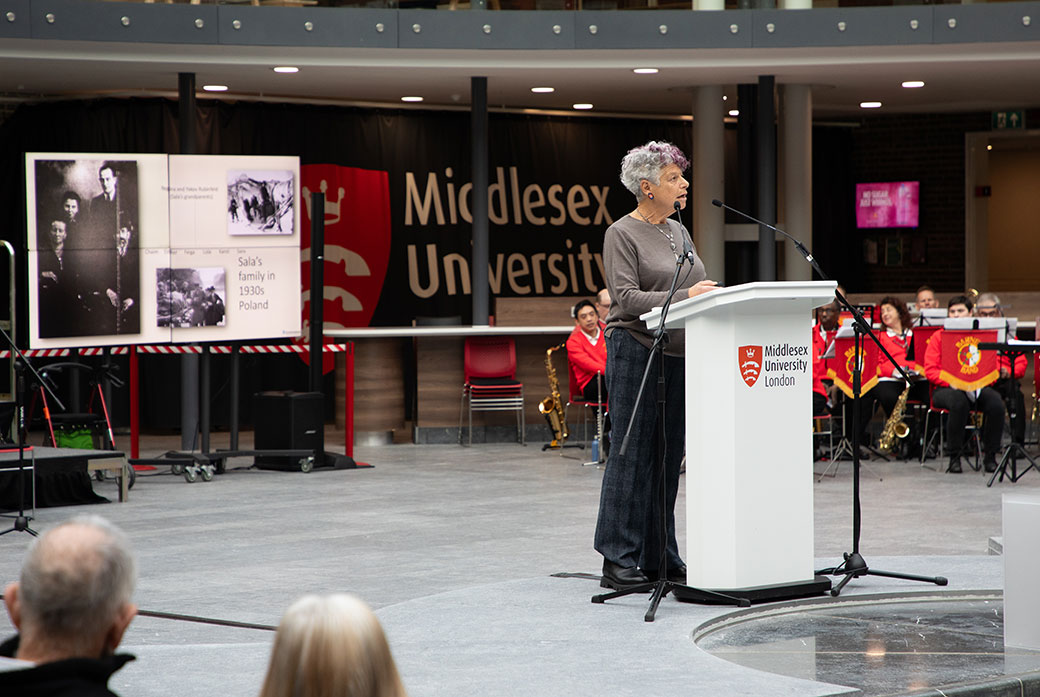 A woman speaks at a memorial event