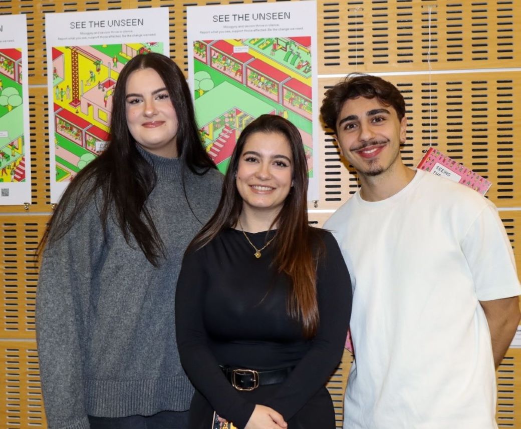 Students stand in front of a poster
