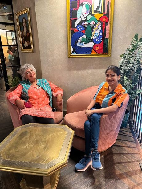 Two ladies posing happy for a picture