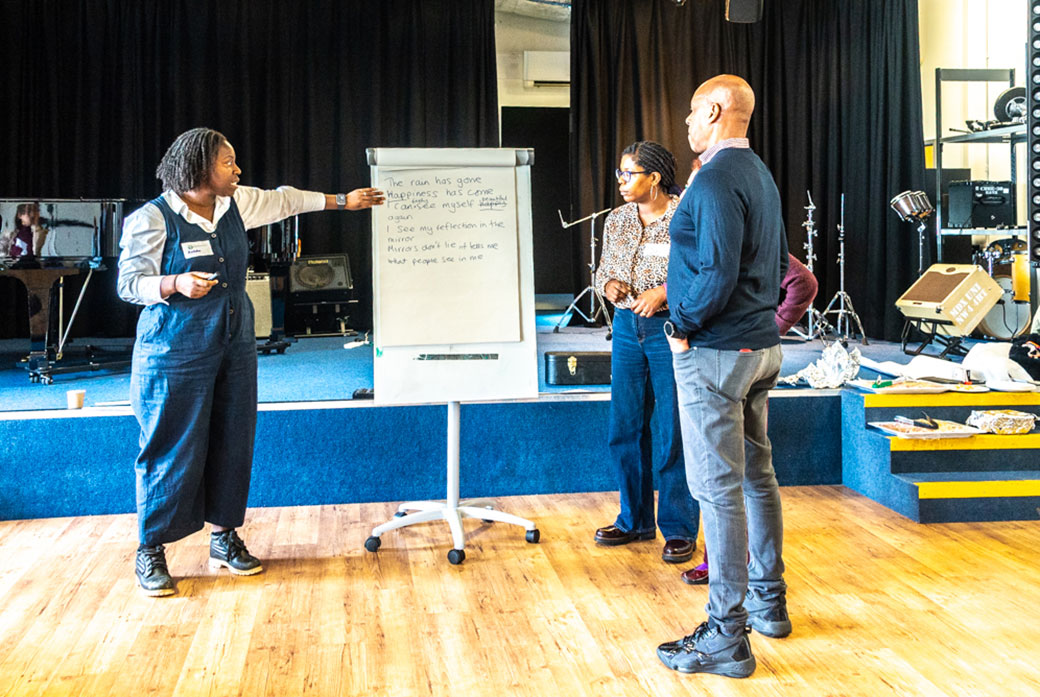 People look at a big sheet of paper