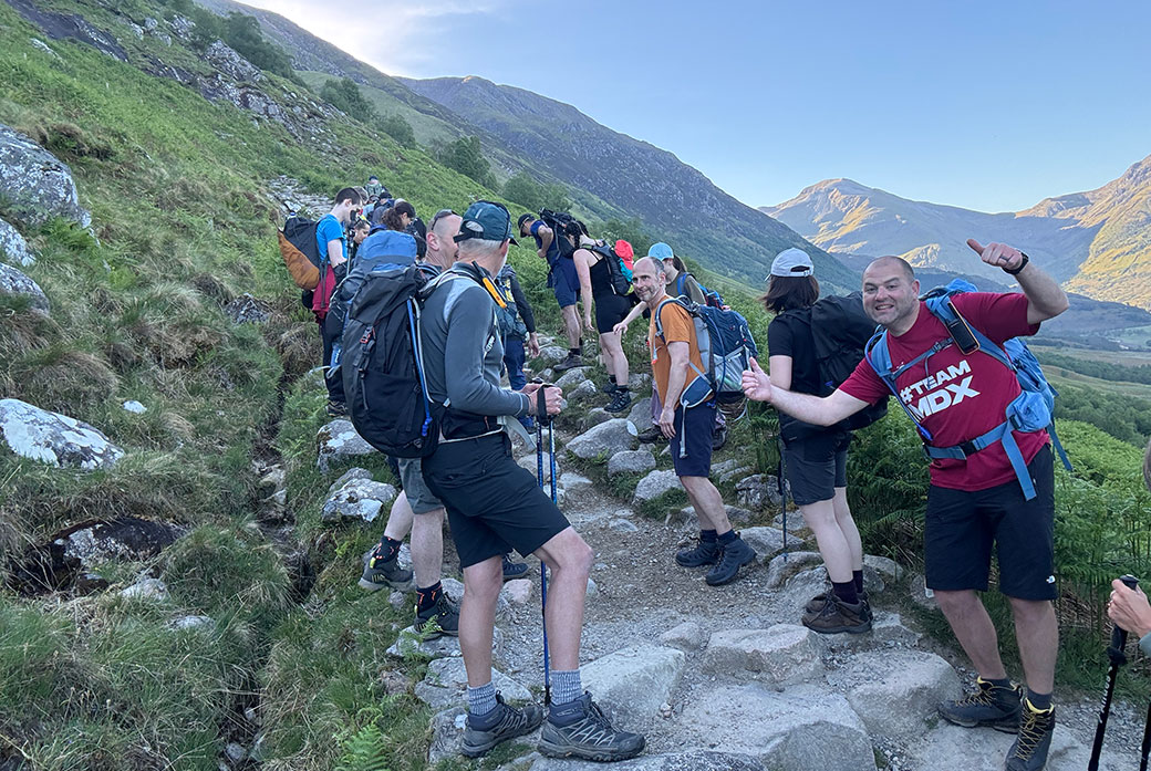 Staff and students walk up a mountain