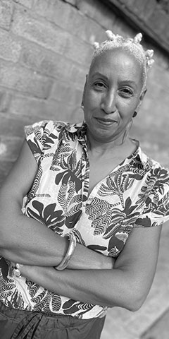 A woman looks at the camera