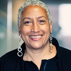A woman looks at the camera