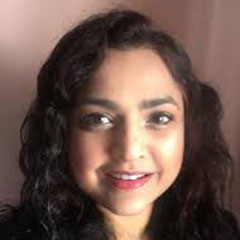 A woman looks at the camera