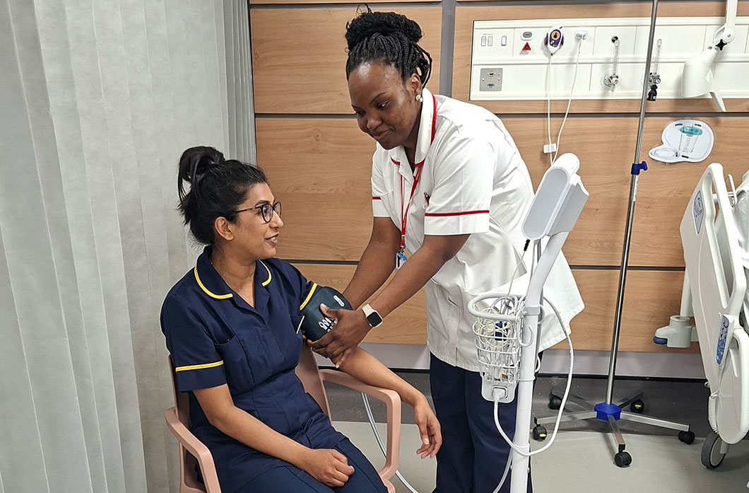 Student nurse performs a blood pressure check