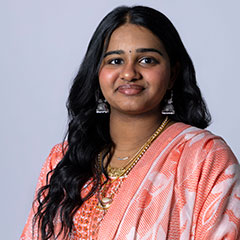 A student looks at the camera