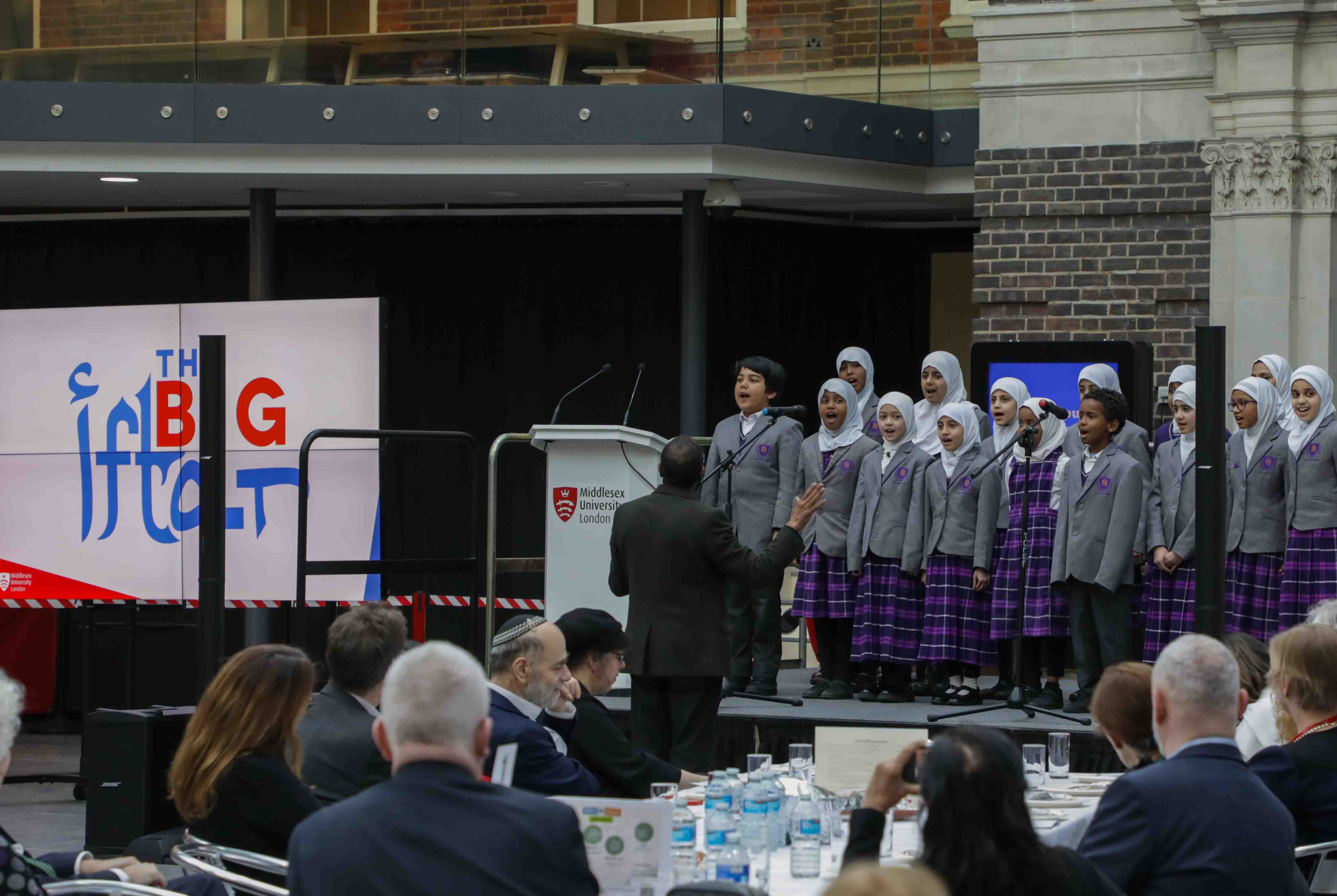 children singing on stage at Big Iftar