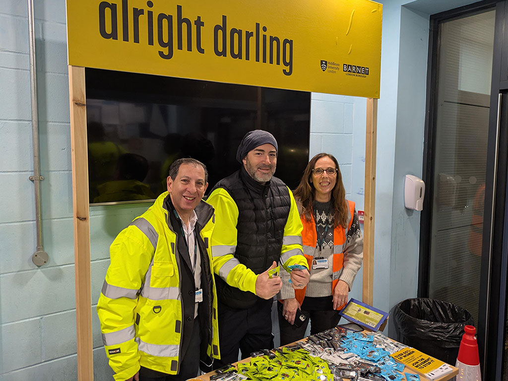 Barnet Council staff stand with awareness campaign stand