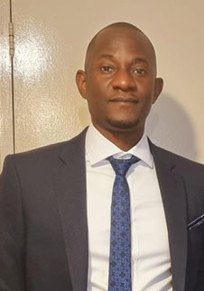 research student of Middlesex university known as Cephas Mpungu wearing a suit