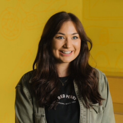 Person in front of yellow background