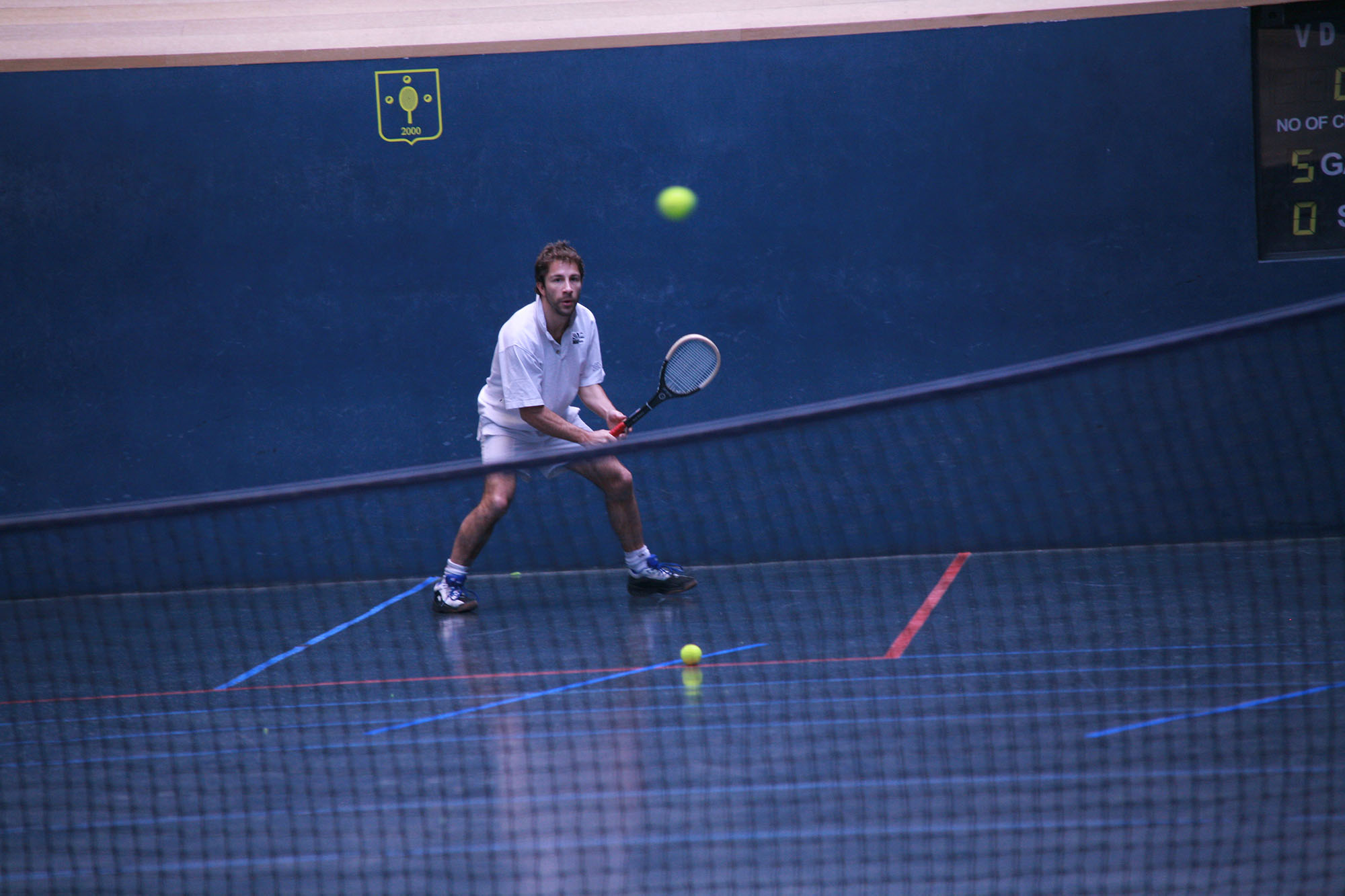 student playing tennis