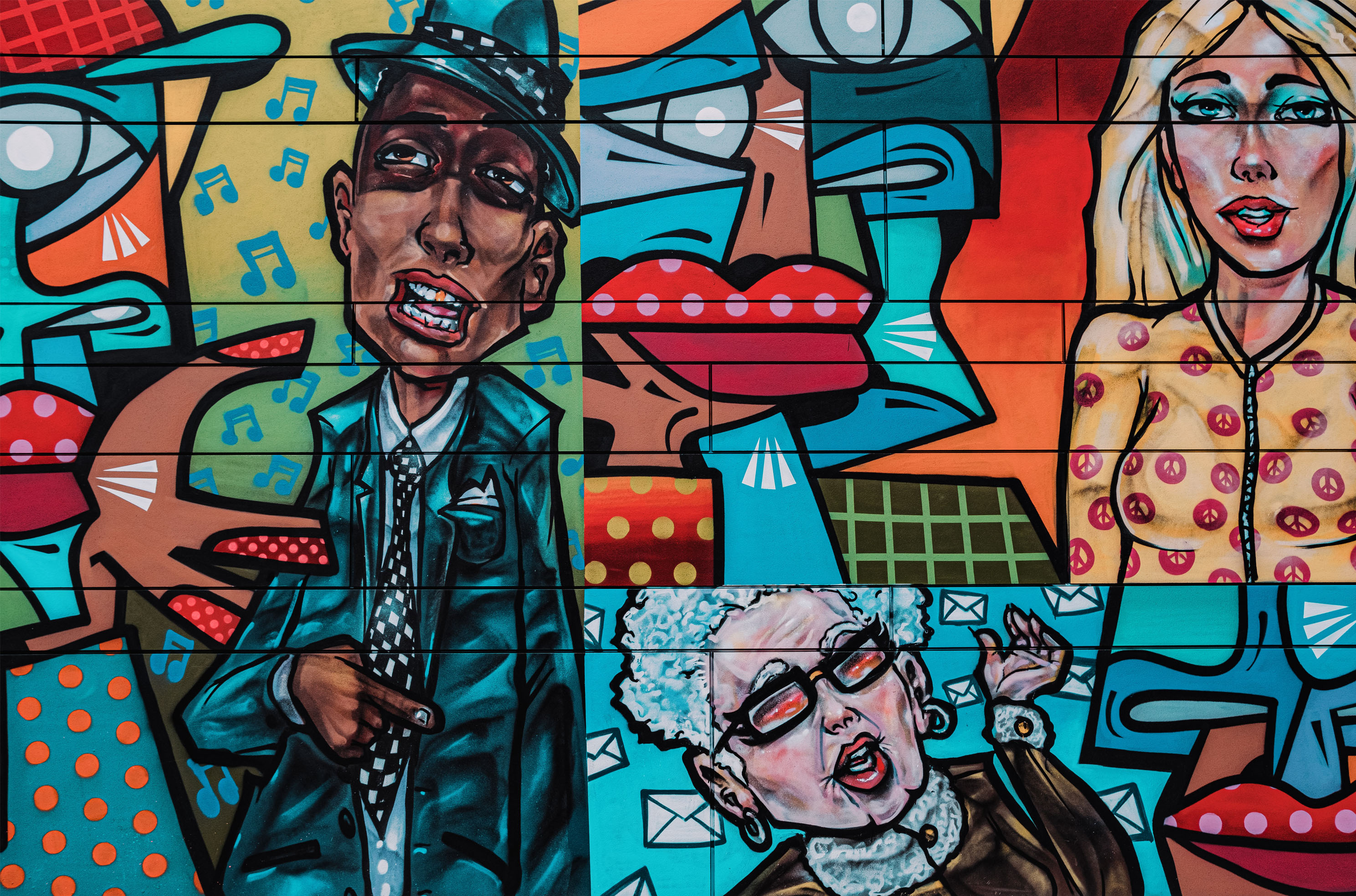 colourful mural in shoreditch with abstract images and cartoon people