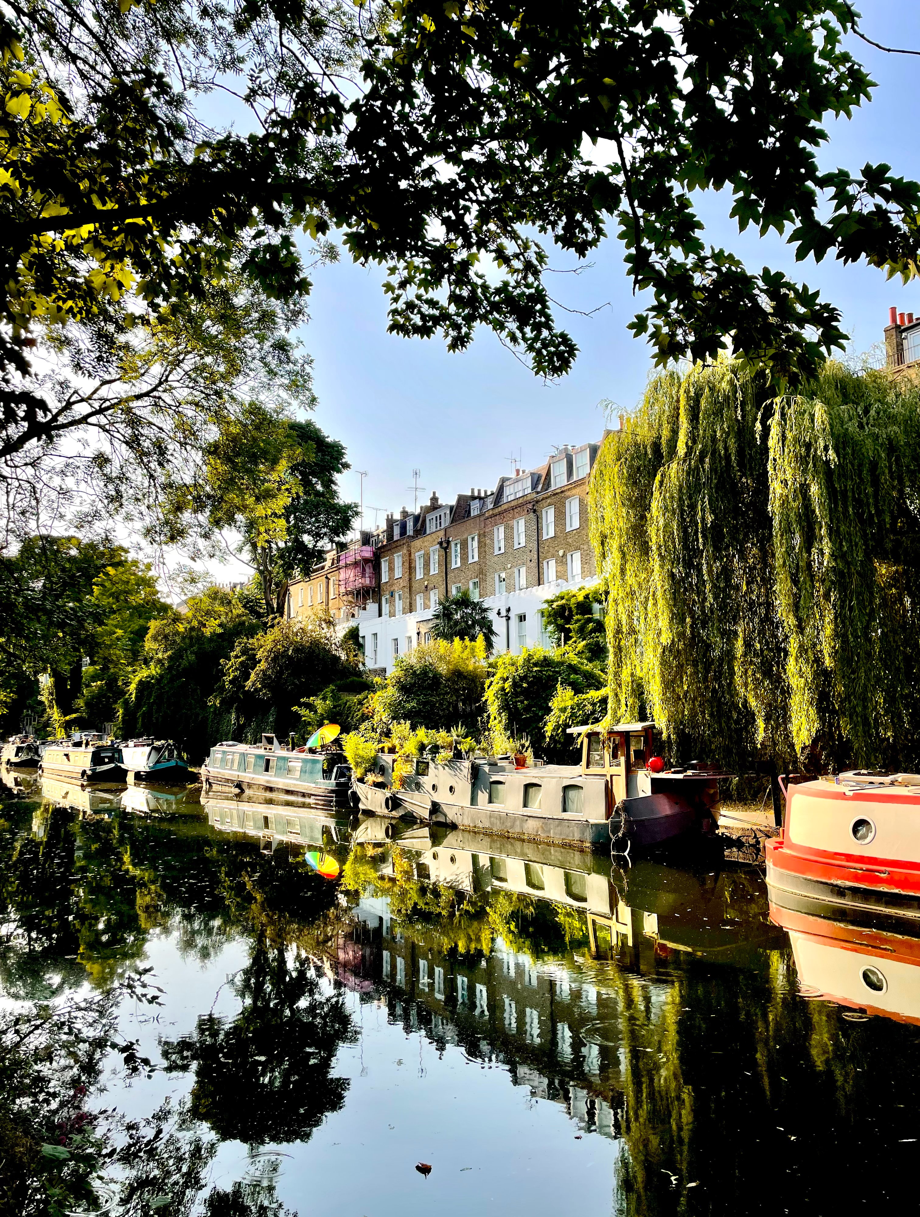 view of the houses and canal boats along the regents canal london