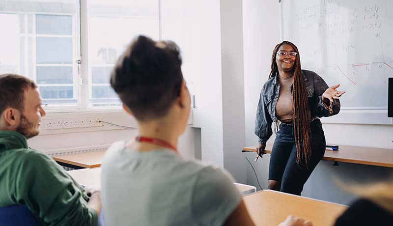Economics students in classroom discussion