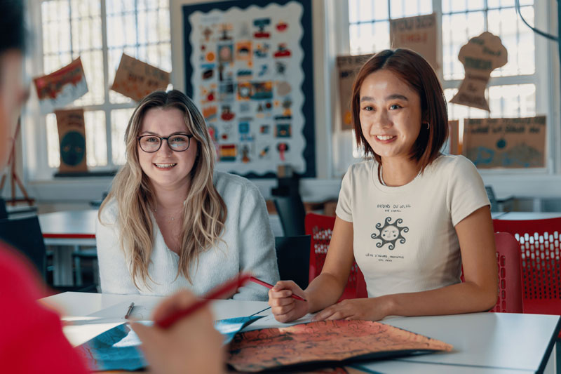 Students teaching others in classroom